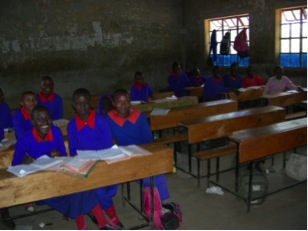 Pictured above are Kuntai Primary School students in new school uniforms donated by OFDC and desks funded by OFDC and parents.